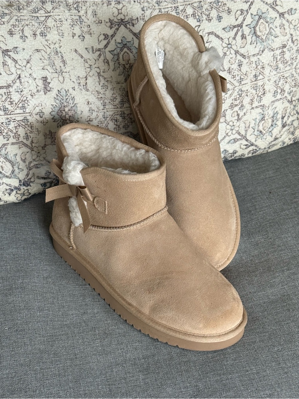 Koolaburra Tan Shearling-Lined Ankle Booties with Bow Detail. UGS